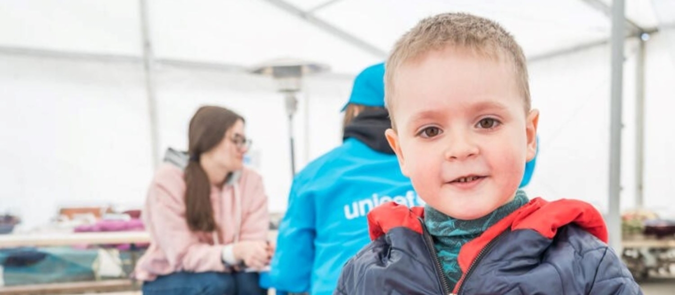 Maxim, 4, is playing at the Mother and Child tent at the Blue Dot centre in Isaccea, Romania.