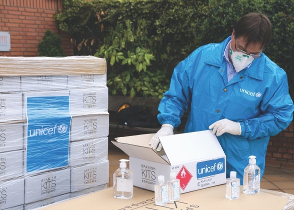 UNICEF healthcare worker packages medical supplies in Spain.
